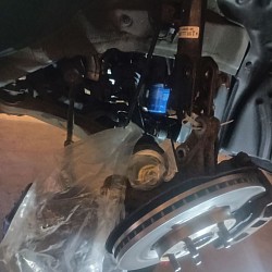 A CV (Constant Velocity) axle, also known as a half shaft, is a drivetrain component that transfers power from the vehicle’s transmission to the wheels while accommodating steering and suspension movement. It features inner and outer CV joints that maintain smooth torque delivery and consistent wheel speed, even at varying angles. CV axles are essential for front-wheel drive, all-wheel drive, and some rear-wheel drive vehicles. Signs of a failing CV axle include clicking noises while turning, grease leakage, and vibration while driving.