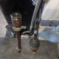 A bad carrier bearing is a common issue in vehicles with a two-piece driveshaft. The carrier bearing supports the center of the driveshaft, helping to keep it aligned and rotating smoothly. When the carrier bearing fails, it can cause a variety of symptoms, including:  1. Vibration: You'll likely feel a noticeable vibration coming from under the vehicle, especially when accelerating or maintaining speed. This vibration occurs because the driveshaft is no longer properly supported, leading to an imbalance.   2. Unusual Noises: A bad carrier bearing often produces a humming or grinding noise, which can increase with speed. In some cases, you may hear clunking sounds when shifting the vehicle into gear or during acceleration/deceleration.   3. Handling Issues: The misalignment of the driveshaft can cause instability or pulling to one side while driving, particularly at higher speeds.   4. Visual Damage: If the bearing is severely worn, the rubber casing may be cracked or torn, and there may be visible play or movement in the driveshaft when the vehicle is stationary.    Fixing a bad carrier bearing typically requires replacing the bearing itself and sometimes the entire driveshaft, depending on the severity of the damage. It's essential to address this issue promptly to prevent further drivetrain damage.
